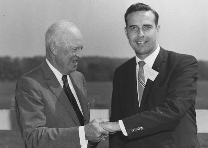 Dwight D. Eisenhower shaking hands with Bob Dole